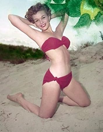 Young woman in bikini posing on beach Poster Print (24 x 36)